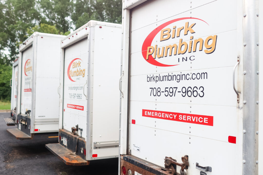 Four Birk Plumbing trucks